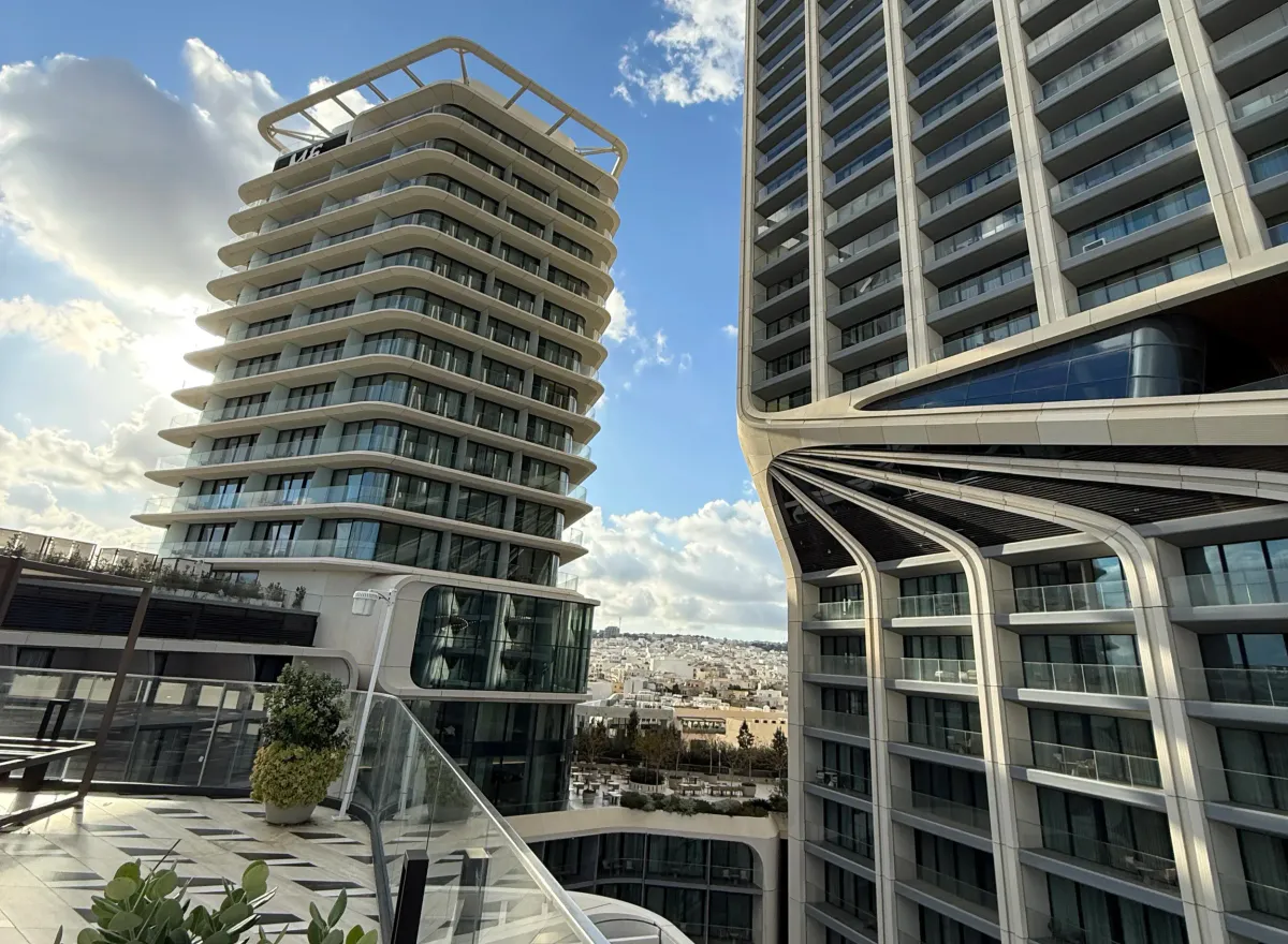 Rooftop terrace view of curved modern towers in Malta