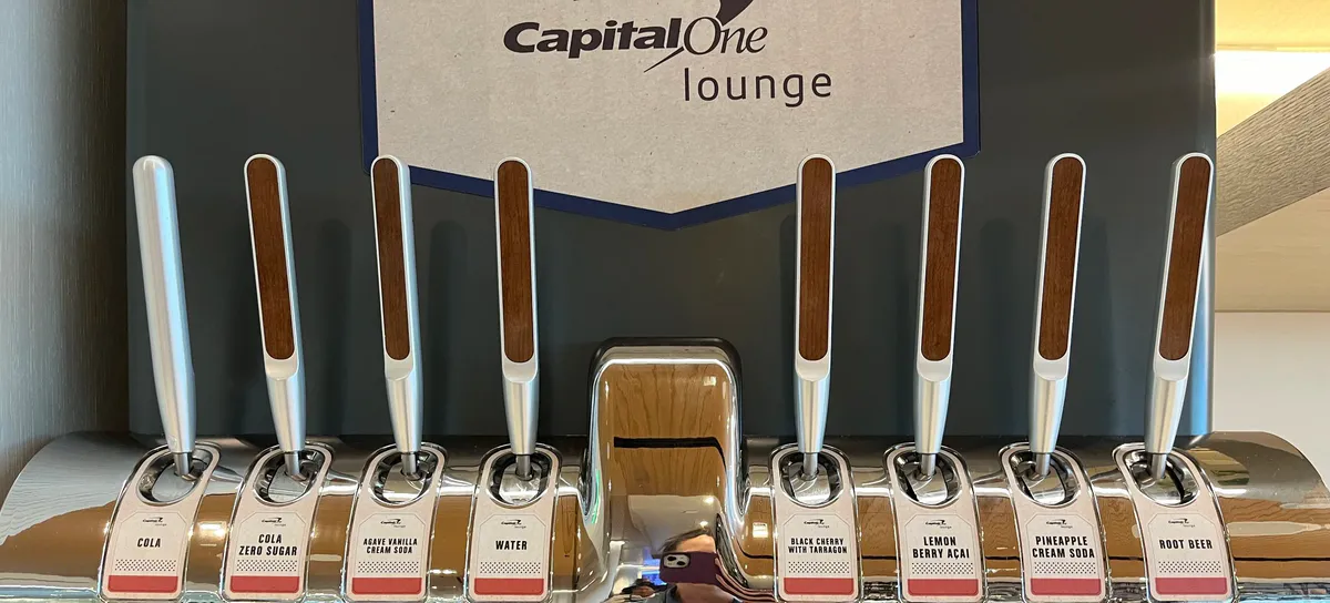 Capital One Lounge soda taps labeled with drink names